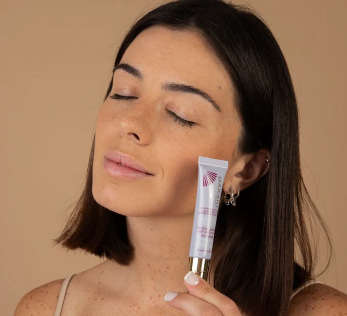 Makari Retinol Control Line Smoothing Eye Cream in white tube with gold applicator