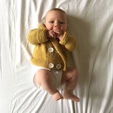 Honey Grown Baby mustard organic cotton knit cardigan on infant