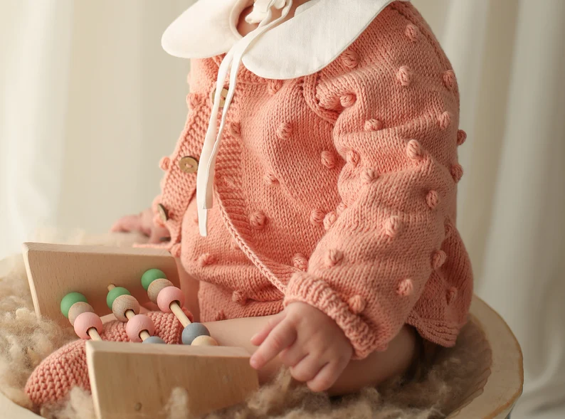 Baby pink organic cotton knit cardigan with textured bobble detail, 0-12 months