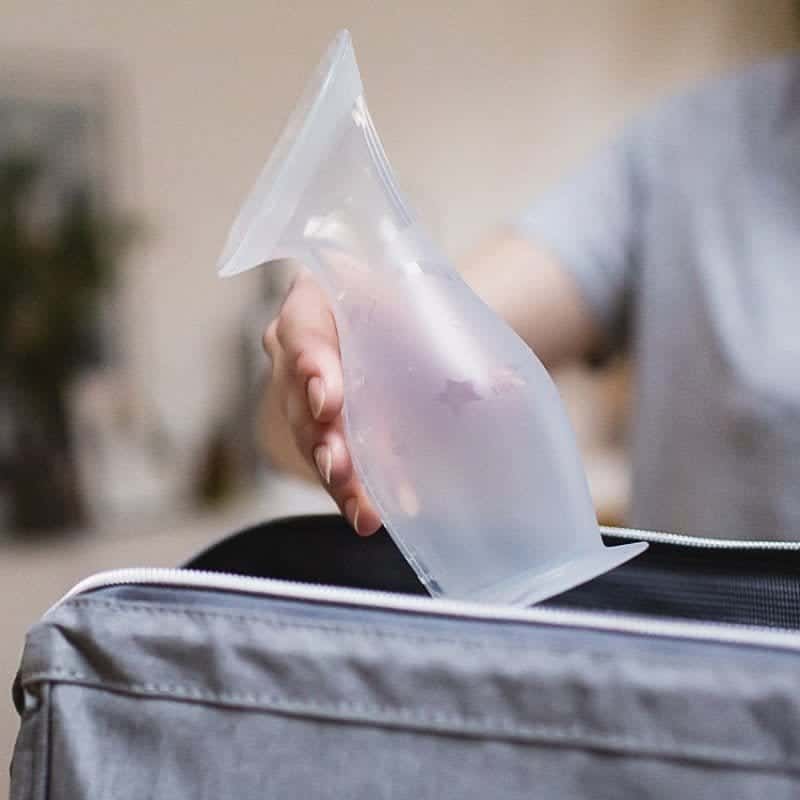 Tommee Tippee Made for Me clear silicone breast pump being held in hand