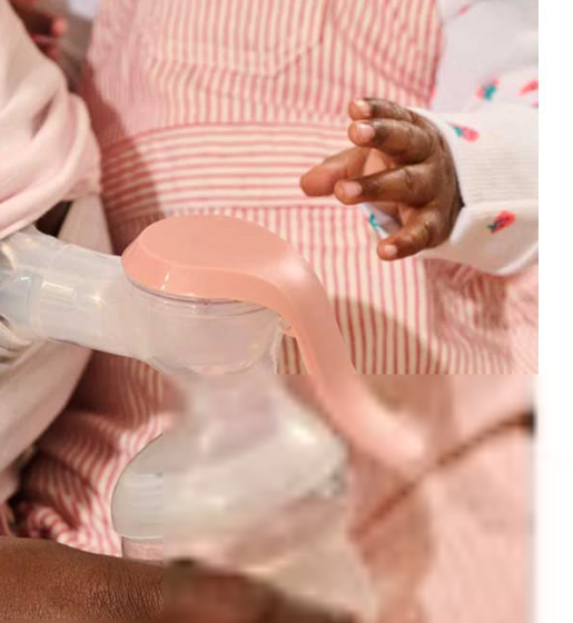 Tommee Tippee manual breast pump with collection bottle, pink and white
