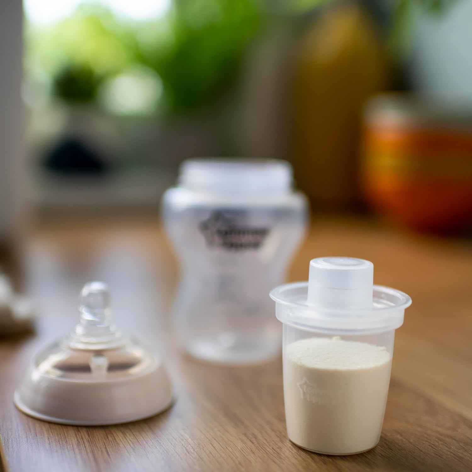 Tommee Tippee Closer to Nature white milk powder dispensers filled with formula, six-pack