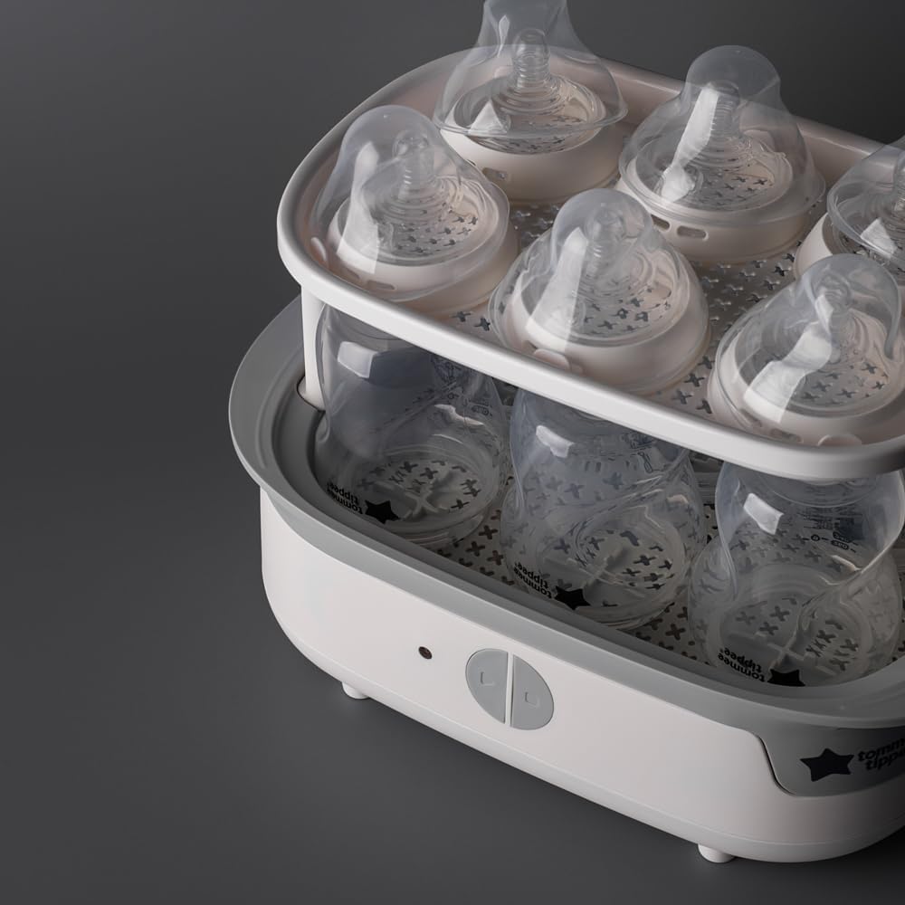 Tommee Tippee white electric steam steriliser with multiple bottles inside