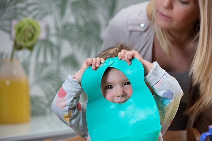 Tommee Tippee Roll n' Go turquoise silicone bib with food pouch pocket