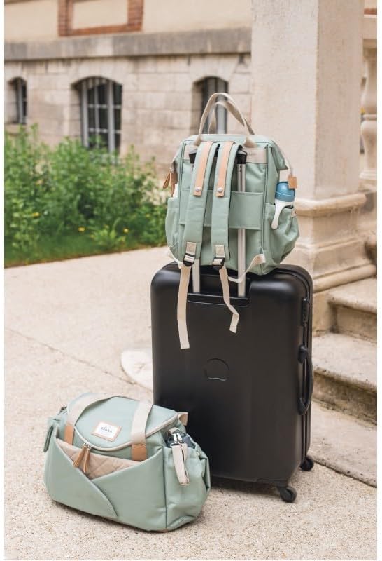 Béaba Sydney II changing bag in leaf green with backpack straps and handles