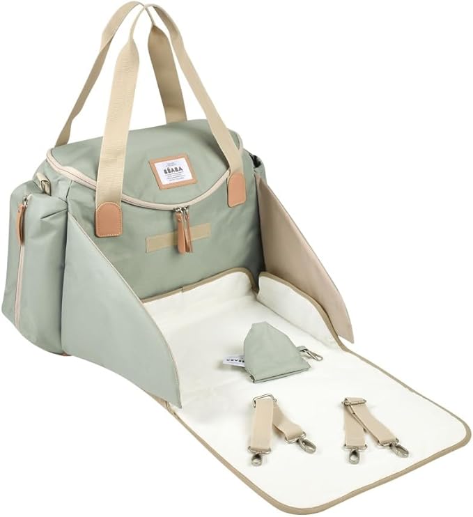 Béaba Sydney II changing bag in leaf green with tan handles and changing mat extended