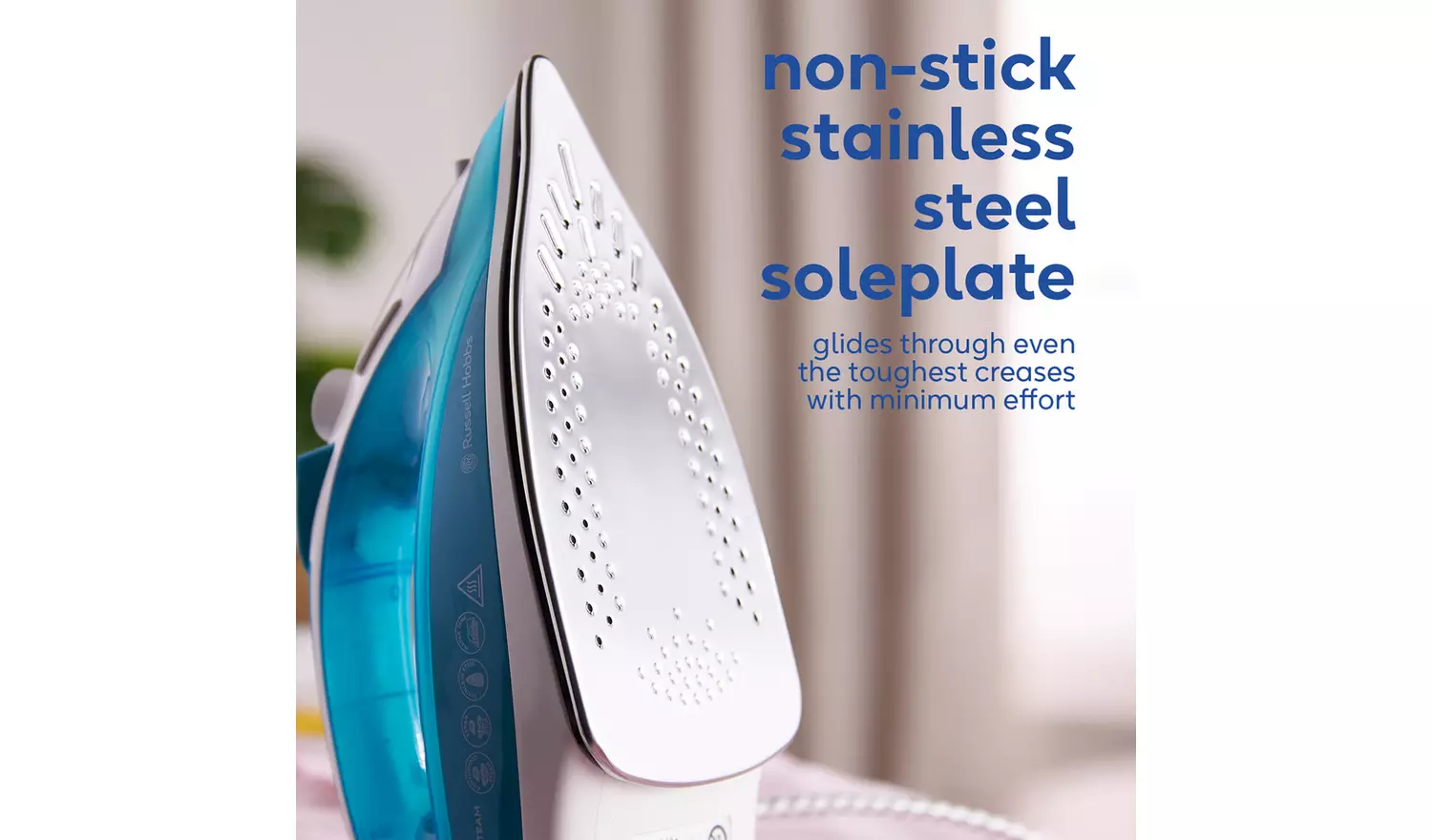 Russell Hobbs Supreme Steam Traditional Iron 23061 with turquoise body and stainless steel soleplate