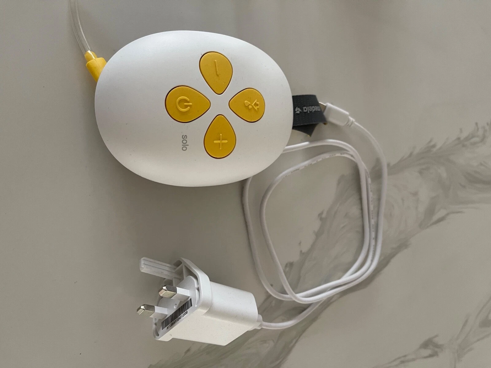 Medela Swing Flex single electric breast pump with white and gold controls