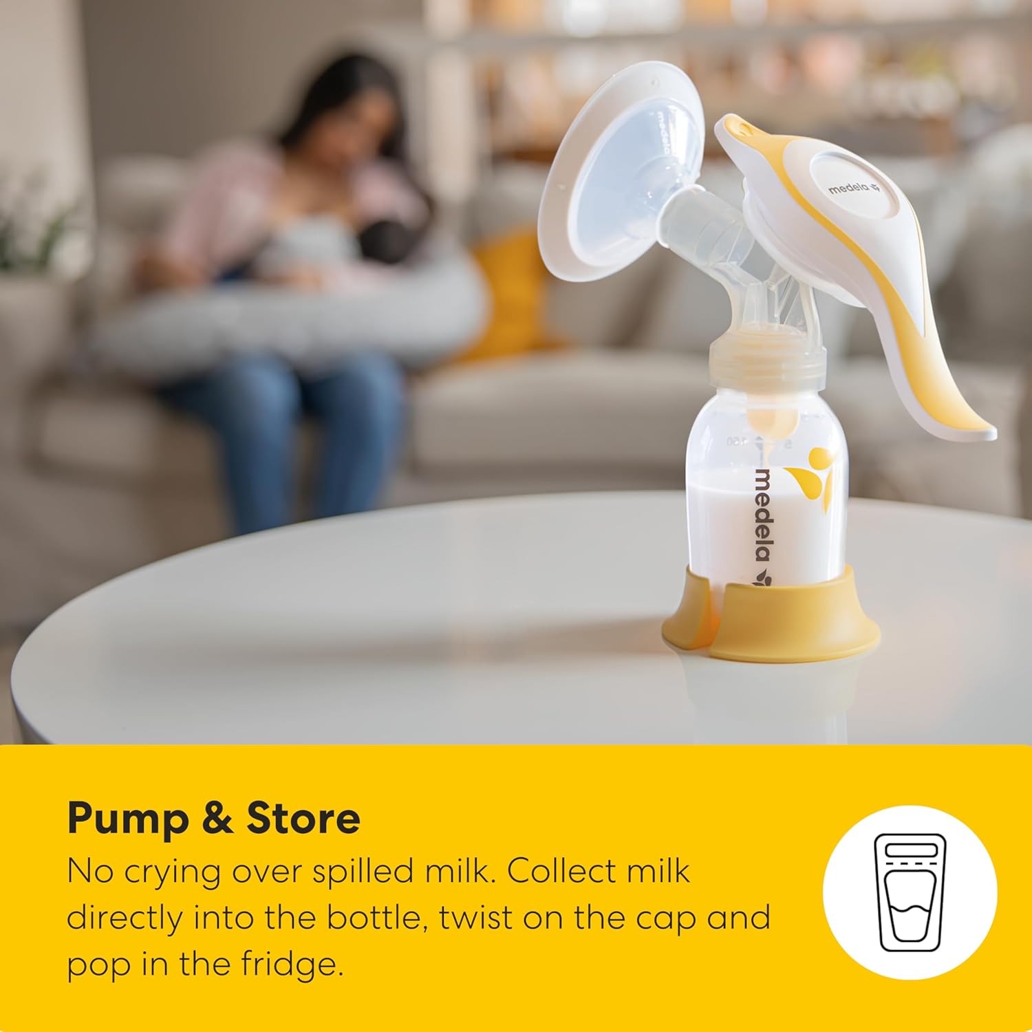 Medela Harmony Flex manual breast pump with yellow accents and collection bottle