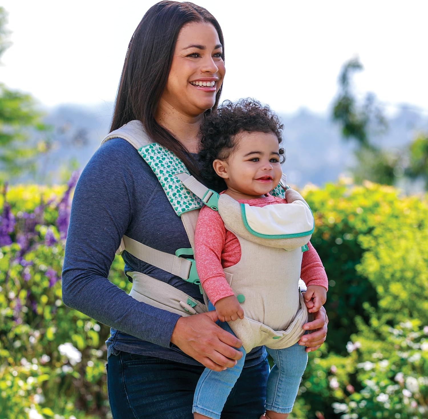 Infantino Flip 4-in-1 convertible baby carrier in cream and green pattern