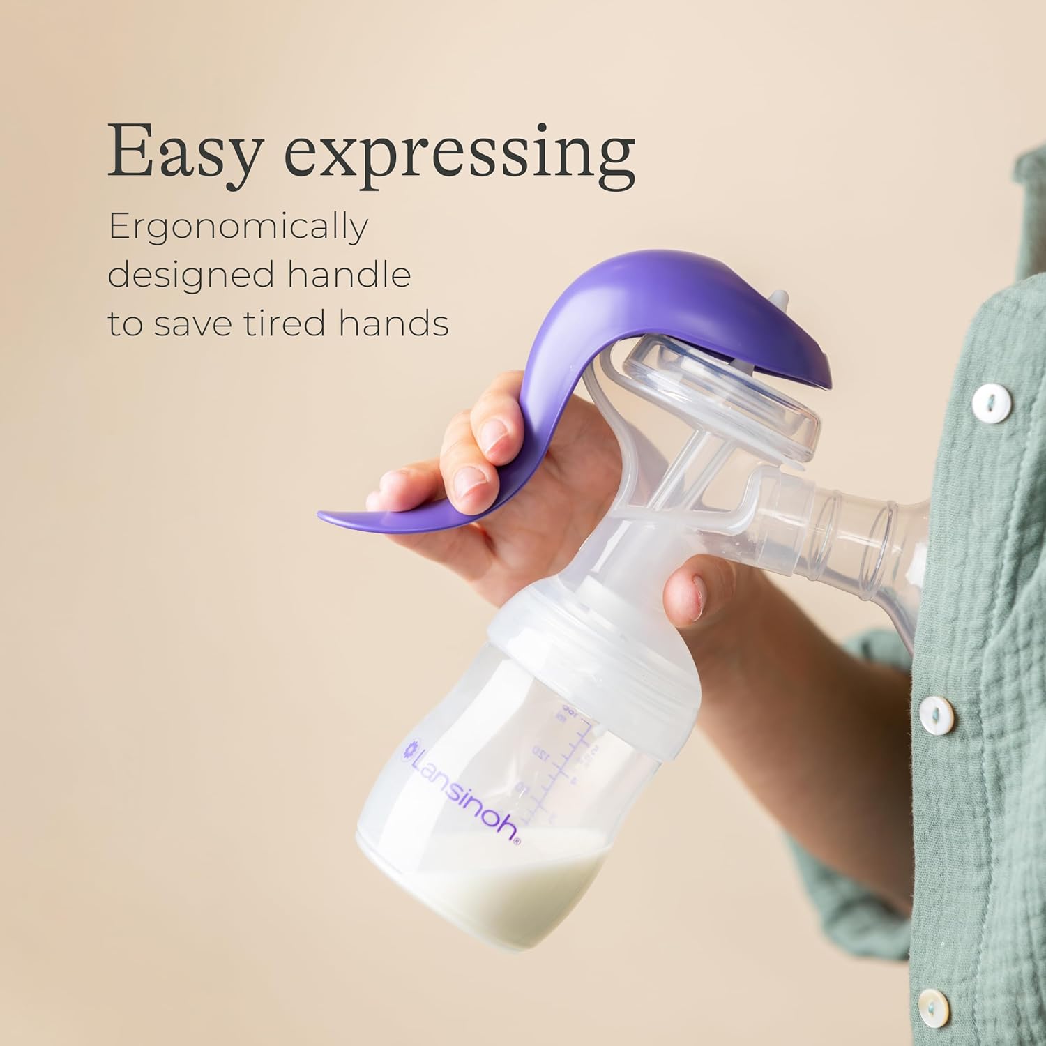 Lansinoh manual breast pump with purple handle and collection bottle