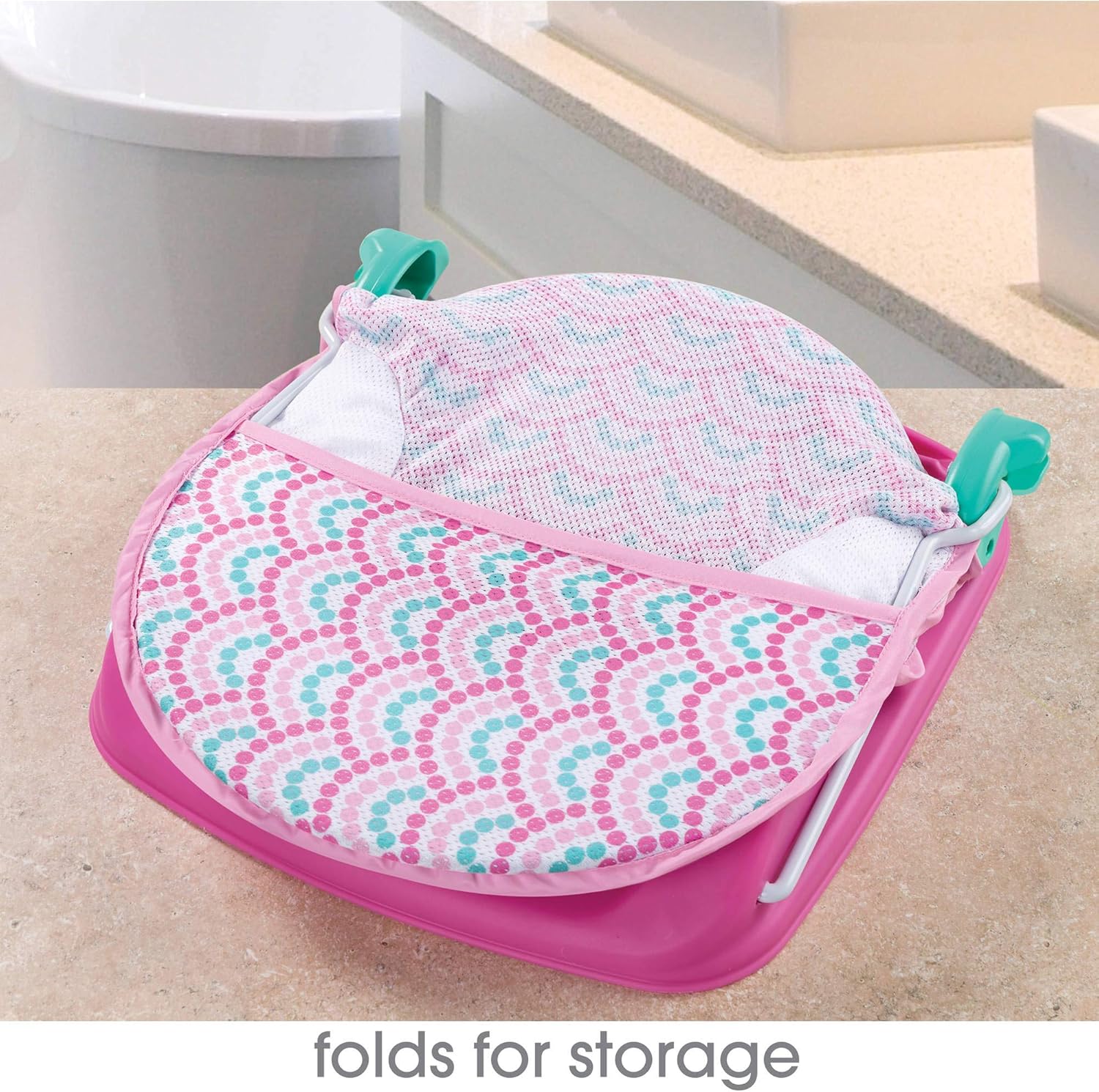 Summer Infant Deluxe Baby Bather in pink with turquoise handles and patterned fabric