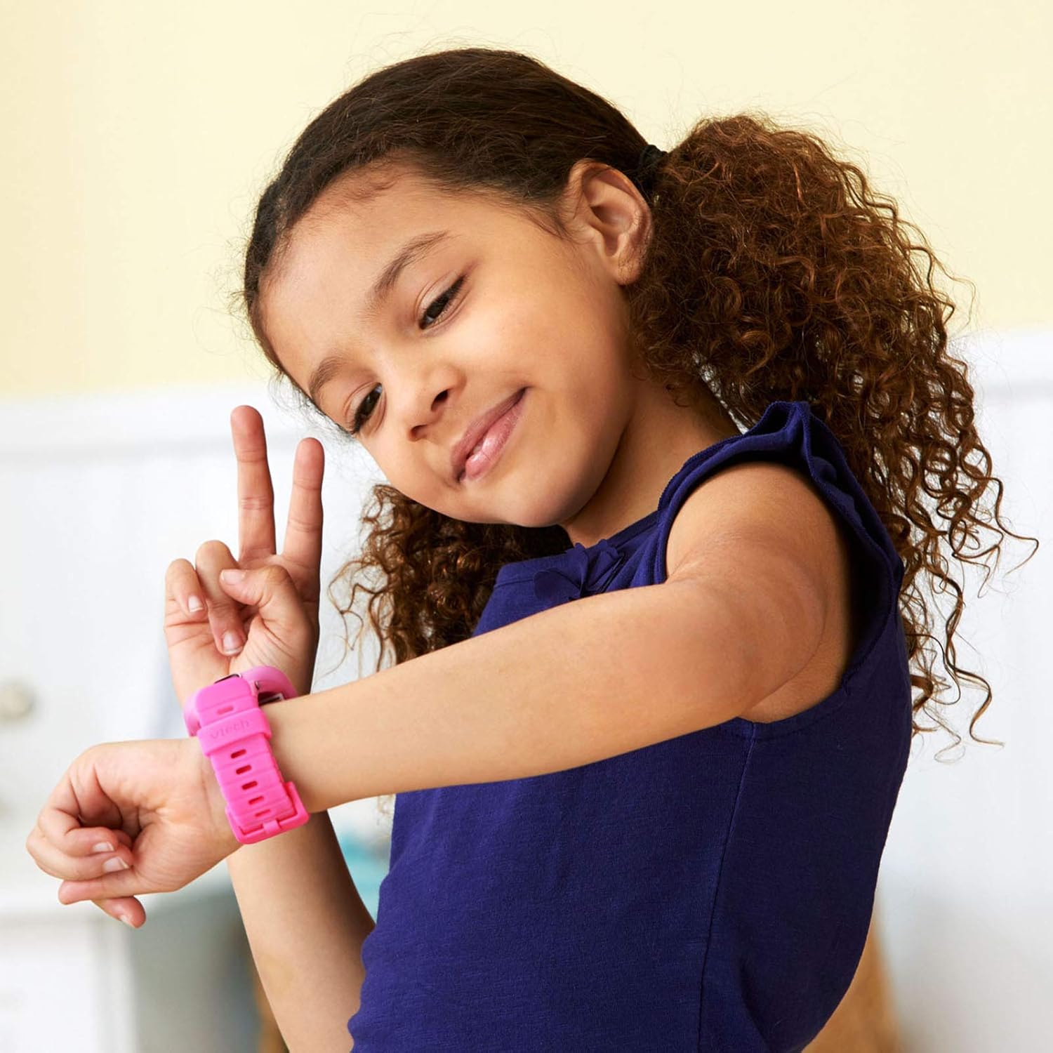 VTech KidiZoom Smartwatch DX2 in pink on child's wrist