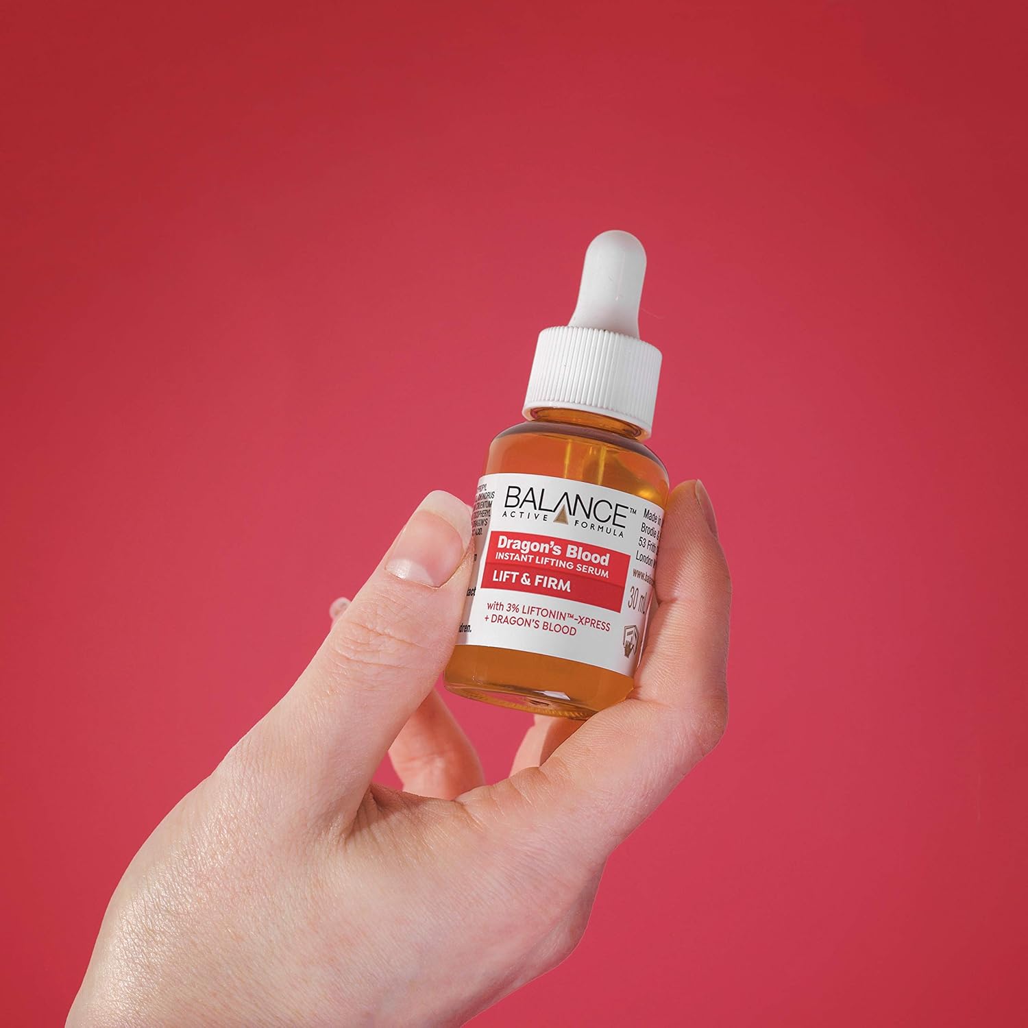 Balance Active Formula Dragon's Blood Instant Lifting Serum in amber glass bottle with dropper