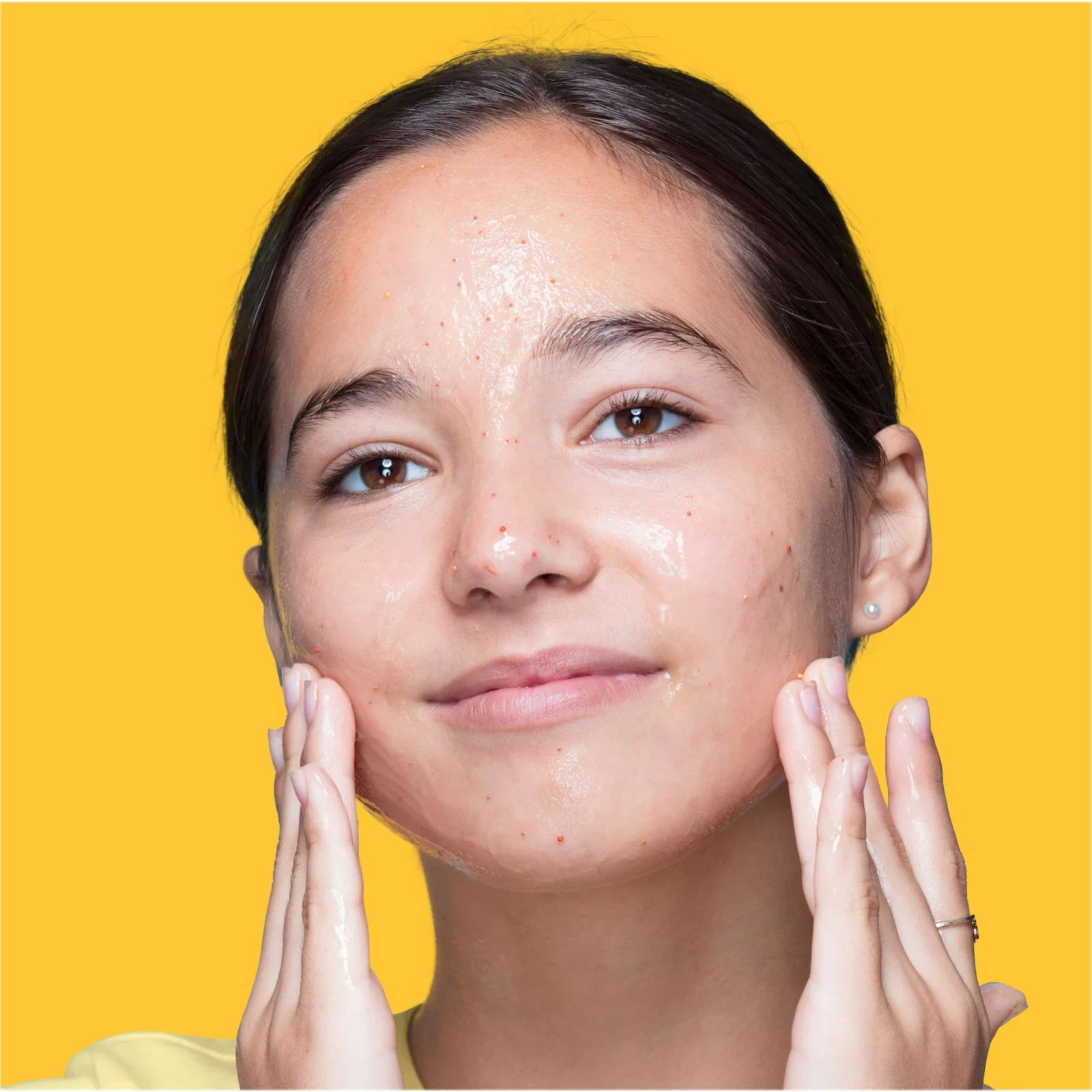 Clean & Clear Morning Burst facial cleanser on person's face