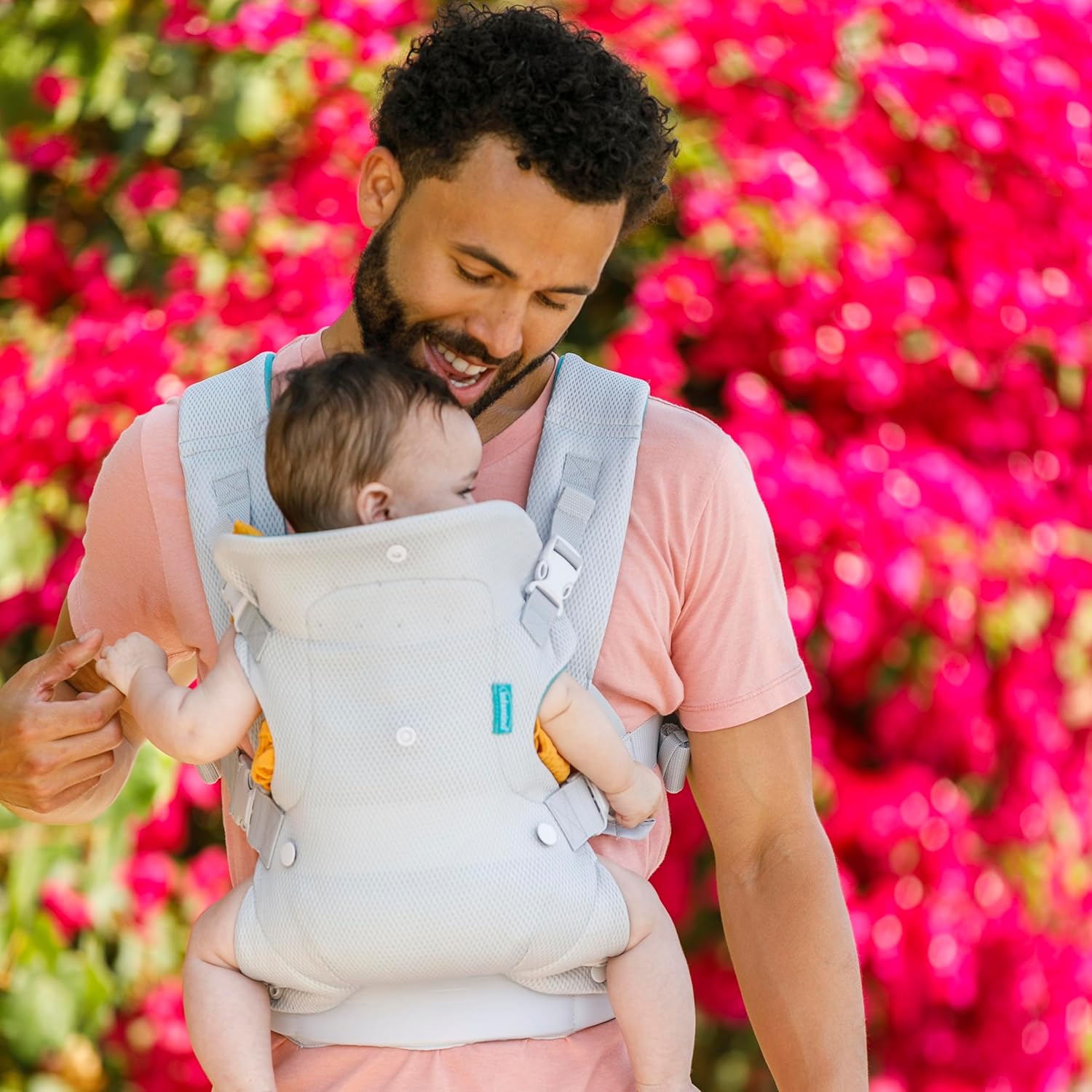 Infantino Flip 4-in-1 convertible baby carrier in light grey and cream with padded straps