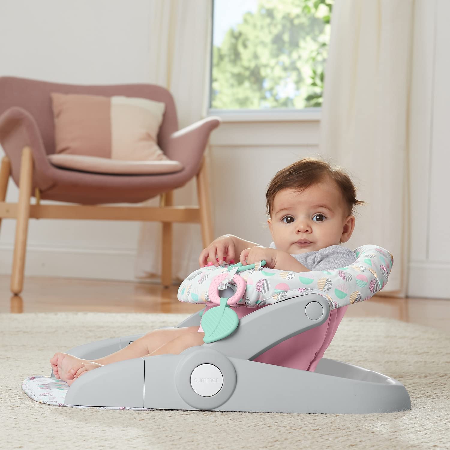 Summer Infant Learn-to-Sit Stage 3 pink and grey floor seat with toy bar