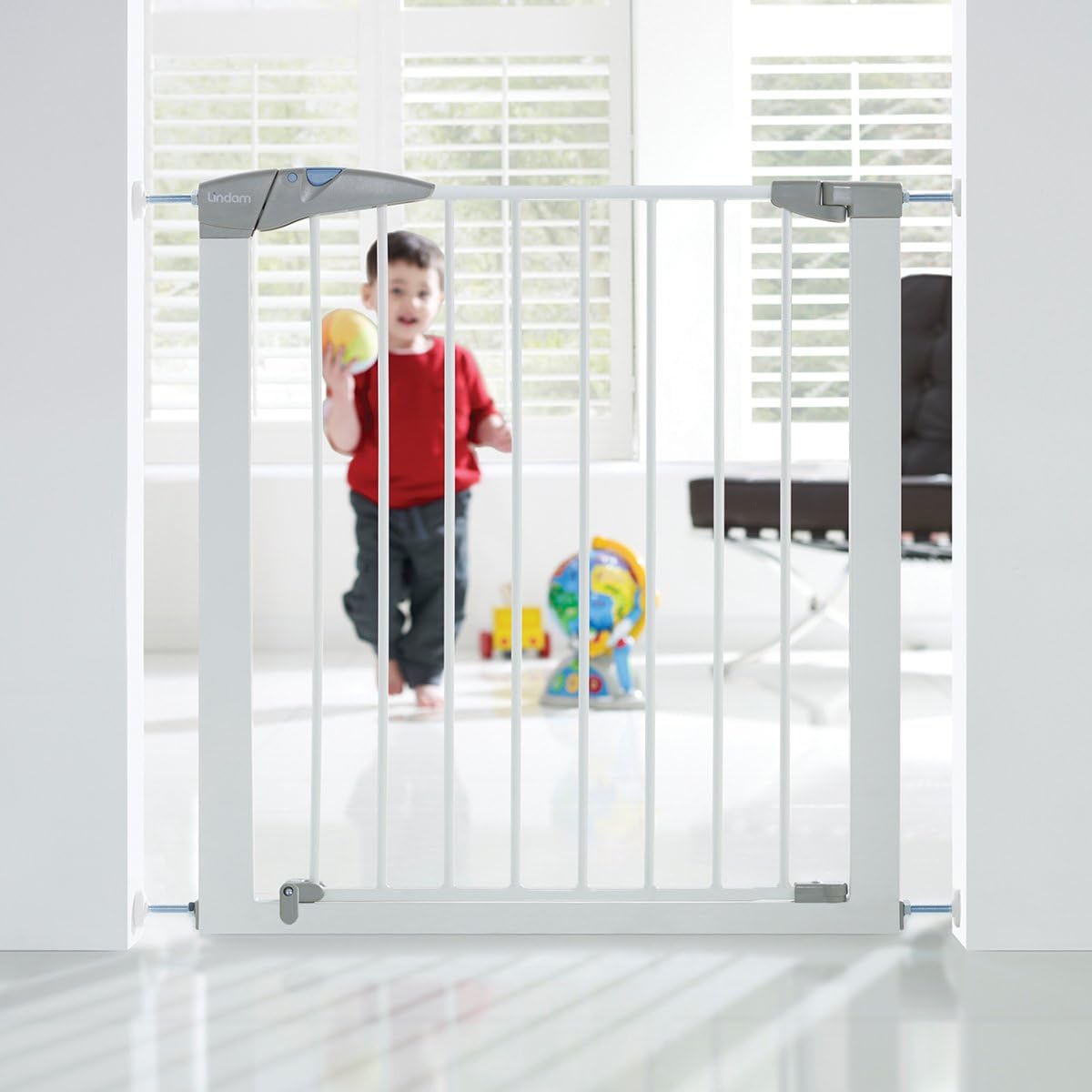 Lindam Sure Shut white baby safety gate with grey handle and latch