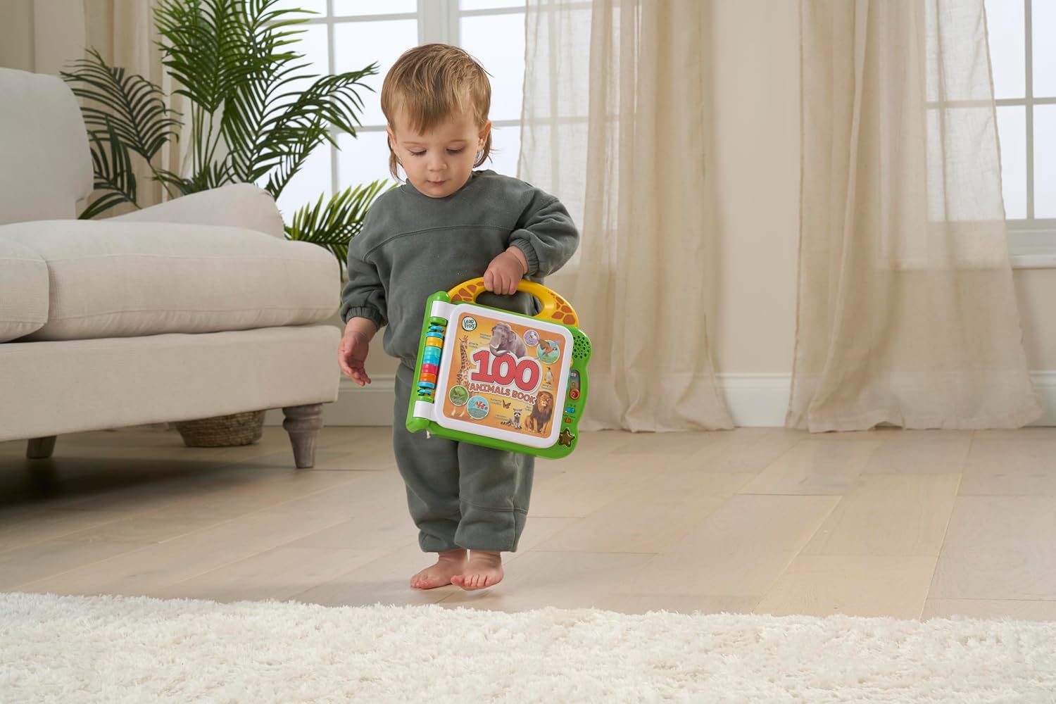 LeapFrog 100 Animals Book interactive learning toy with green and yellow cover