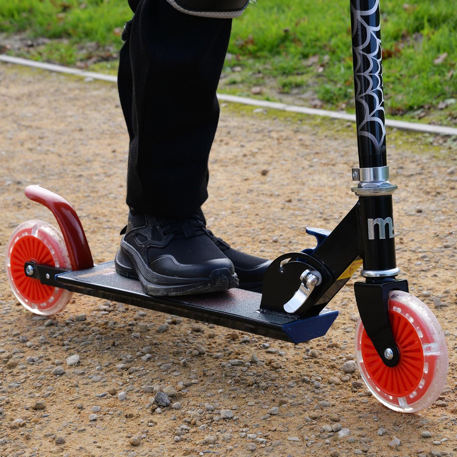 Marvel Spider-Man folding in-line scooter with red wheels and black handlebar