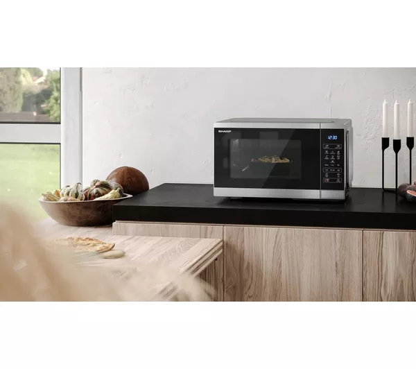 Sharp YC-MS252AU-S silver solo microwave on kitchen counter