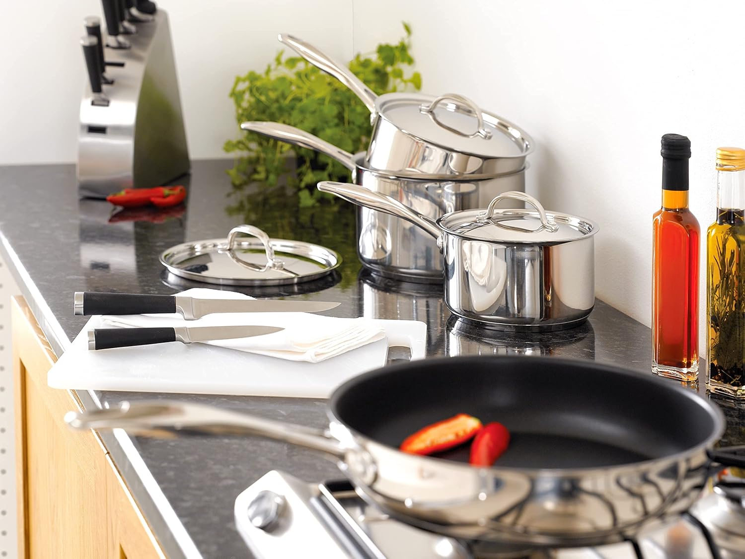 Stellar 7000 stainless steel draining saucepans with strainer lids, five-piece set