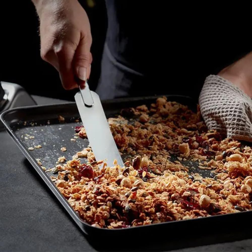 Stellar Expert hard anodised baking tray with baked granola and serving spatula