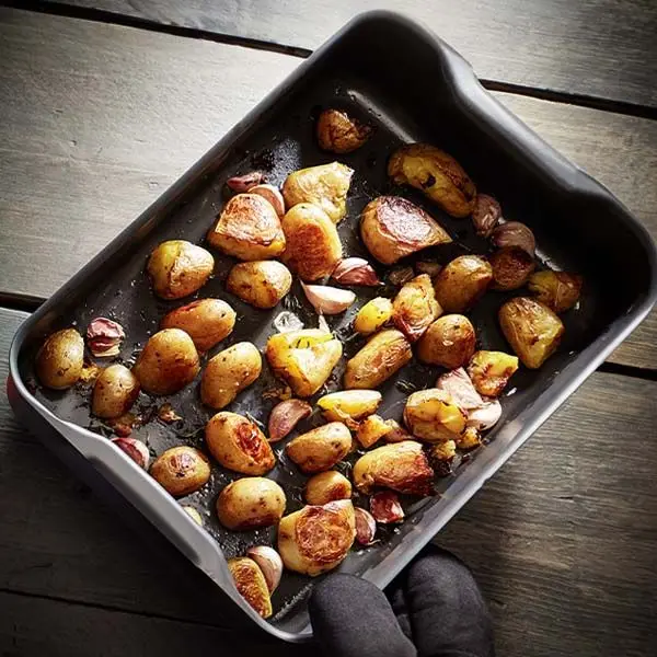 Stellar hard anodised baking tray 26cm x 15cm with roasted potatoes