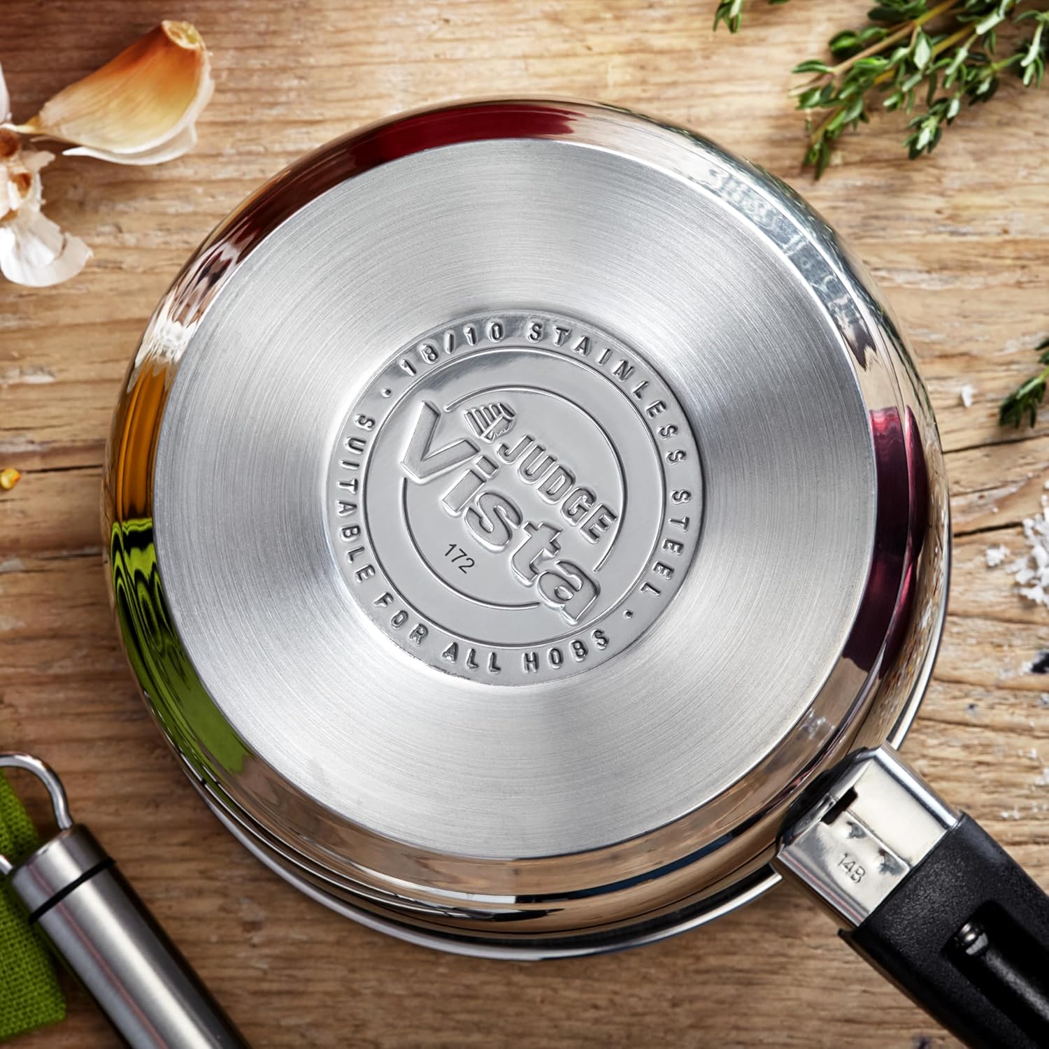 Judge Essentials stainless steel saucepan base with black handle detail