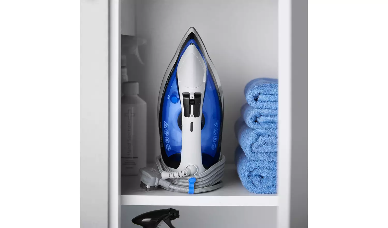 Russell Hobbs Easy Store Pro steam iron with blue and white design stored in cupboard