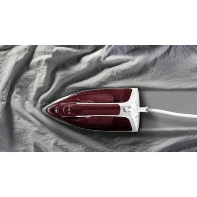 Tefal Express Steam FV2869 white and ruby red steam iron on fabric surface