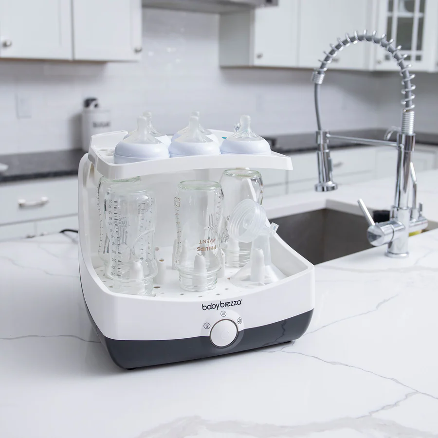 Baby Brezza Superfast Steriliser-Dryer white with bottles and teats loaded