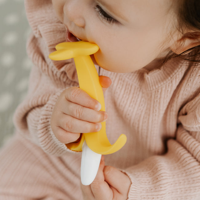 Nuby yellow banana shaped silicone teether for babies