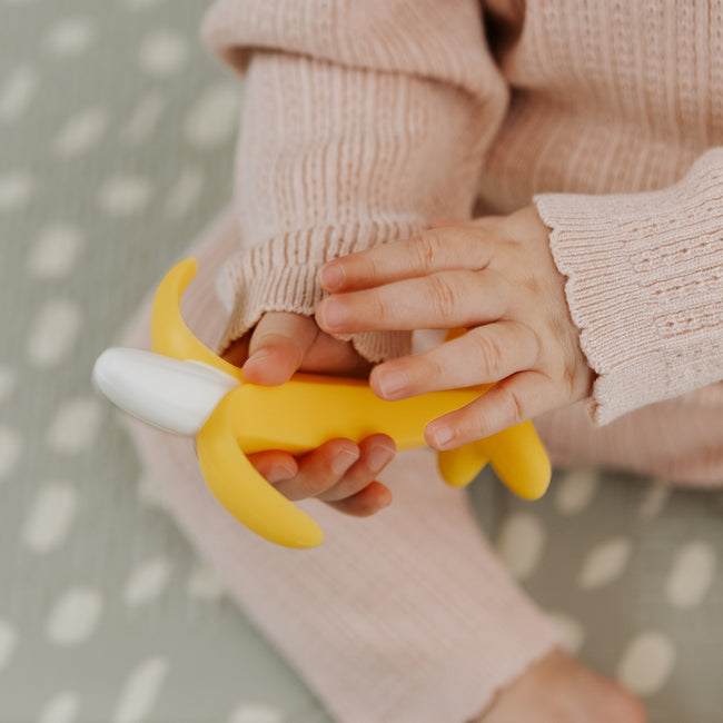 Nuby yellow banana shaped silicone teether for babies