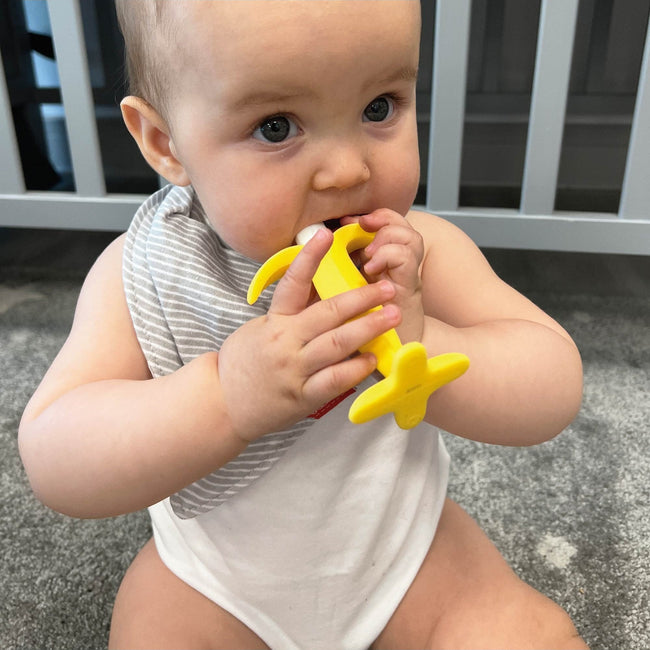 Nuby yellow banana shaped silicone teether for babies