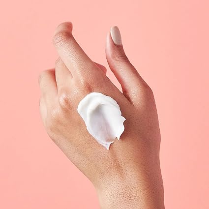 eos Fresh and Cozy hand cream 2.5oz with white cream swatch on hand
